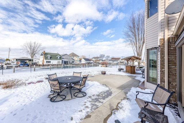 view of snow covered patio