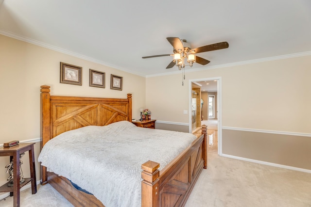 carpeted bedroom with crown molding and ceiling fan