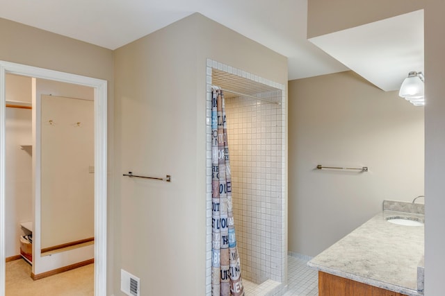 bathroom with vanity and curtained shower