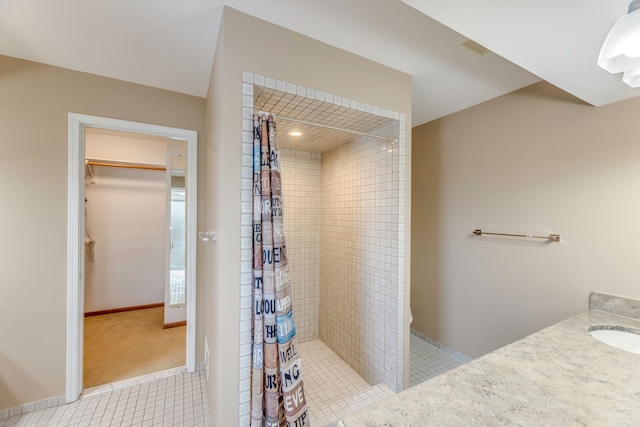 bathroom featuring tile patterned flooring, sink, and a shower with shower curtain