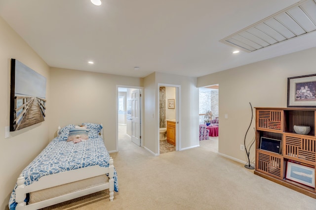 carpeted bedroom with connected bathroom