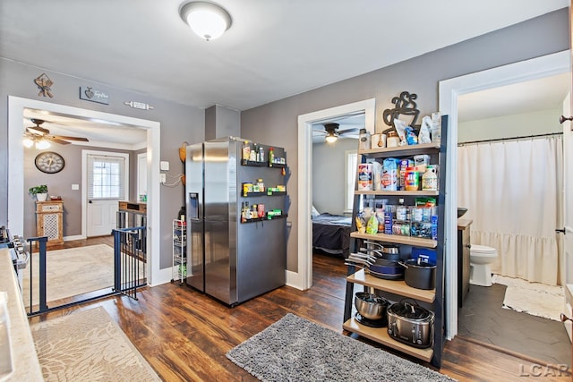 kitchen with dark hardwood / wood-style floors and stainless steel fridge