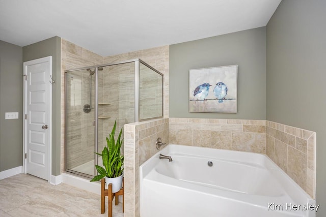 bathroom with shower with separate bathtub