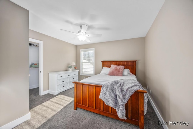 bedroom featuring dark carpet and ceiling fan