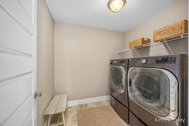 clothes washing area with separate washer and dryer