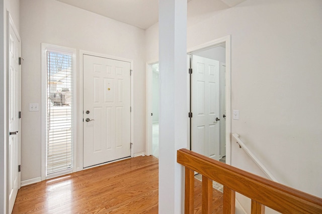 foyer entrance with light hardwood / wood-style floors