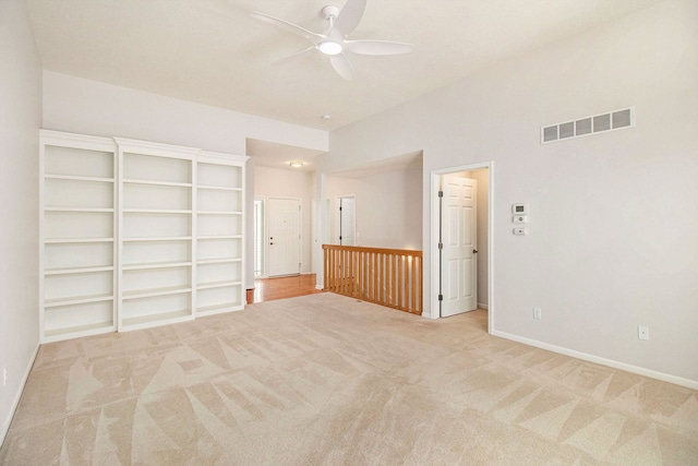 carpeted empty room with ceiling fan