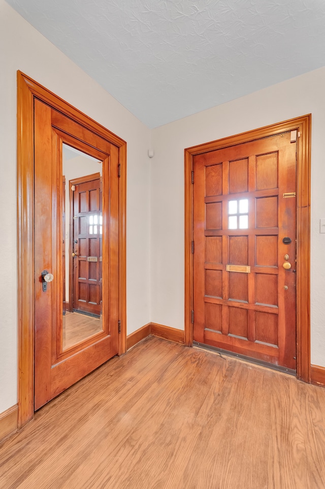 entrance foyer featuring light hardwood / wood-style floors