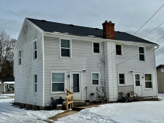 view of snow covered house