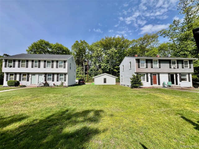 2855 20th Ave, Port Huron, MI 48060 - colonial home with a chimney and a front yard