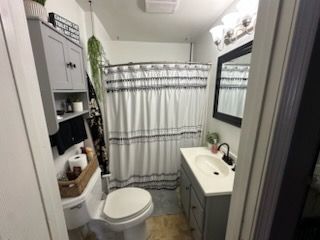 bathroom with vanity and toilet