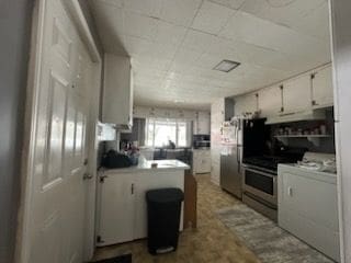 kitchen with white cabinetry, stainless steel appliances, and kitchen peninsula