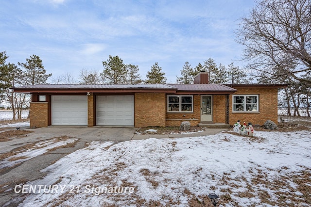 ranch-style home featuring a garage