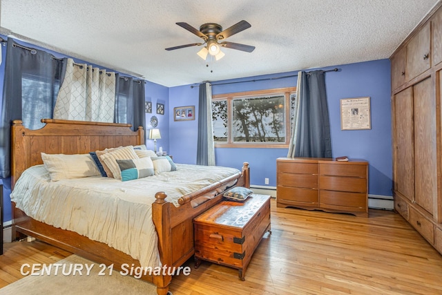 bedroom with baseboard heating, ceiling fan, a textured ceiling, and light wood-type flooring