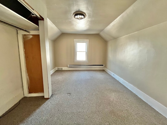 bonus room with lofted ceiling, a baseboard heating unit, and carpet