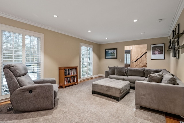 living room with crown molding and light colored carpet