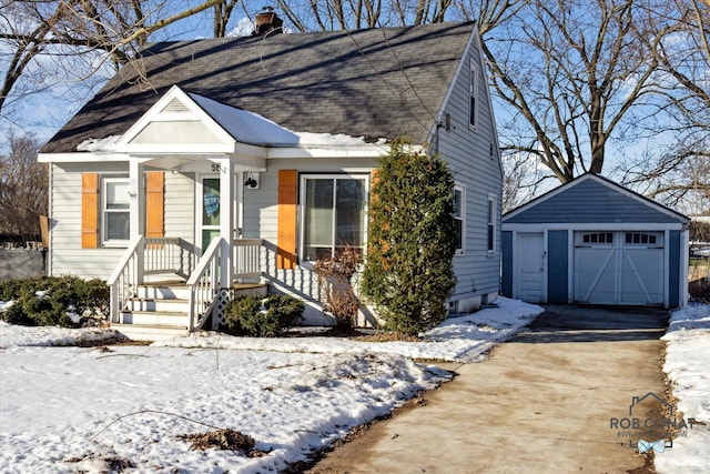 view of front of home featuring an outbuilding and a garage