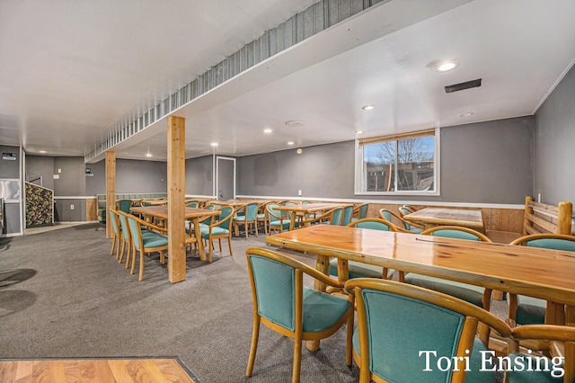 dining space featuring carpet flooring