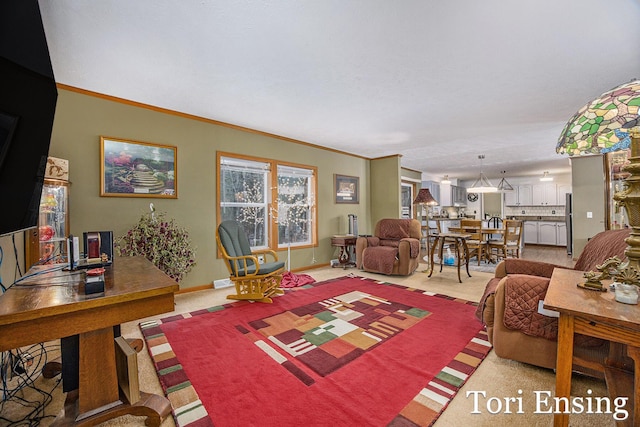carpeted living room with crown molding