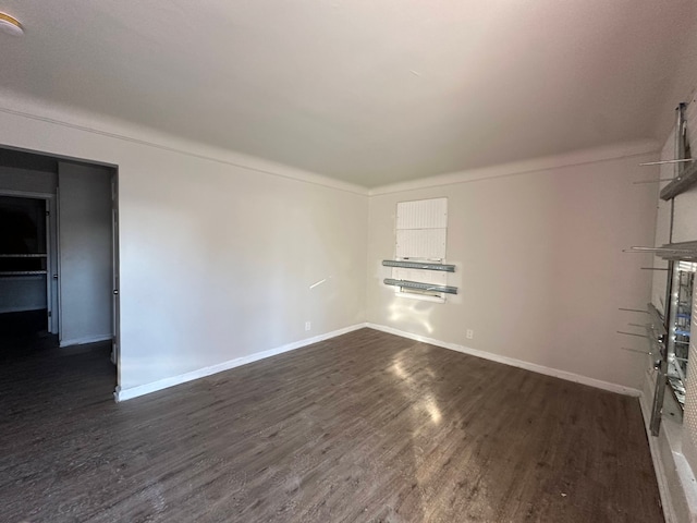 unfurnished room with dark hardwood / wood-style floors