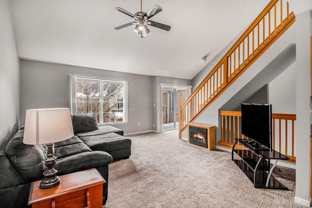 carpeted living room featuring ceiling fan