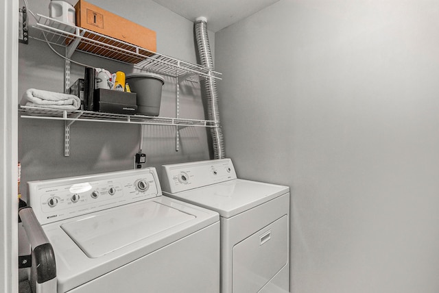 laundry area with washing machine and dryer