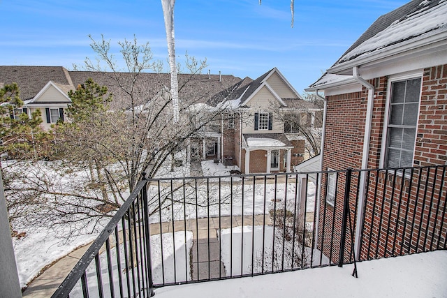 view of snow covered gate