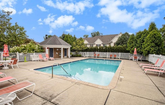 view of swimming pool with a patio