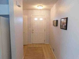 doorway featuring hardwood / wood-style flooring