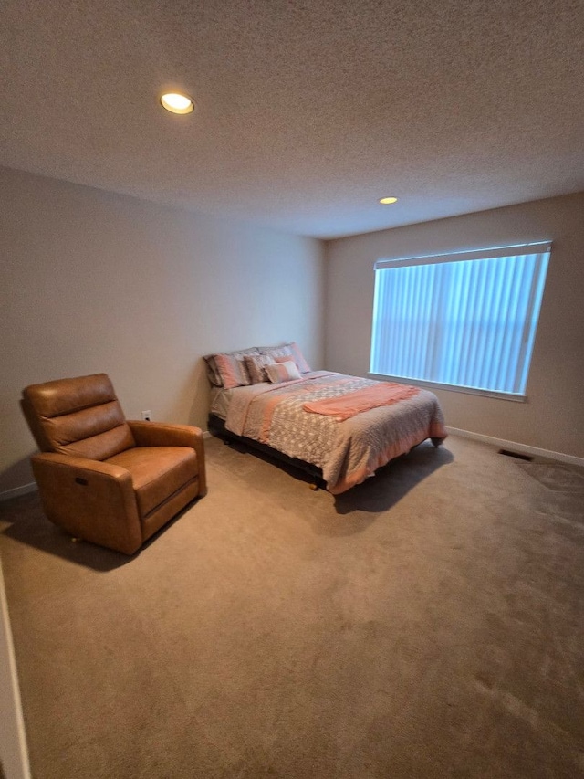 carpeted bedroom with a textured ceiling, baseboards, visible vents, and recessed lighting