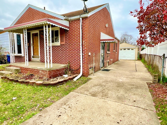 view of front of house with an outbuilding and a garage