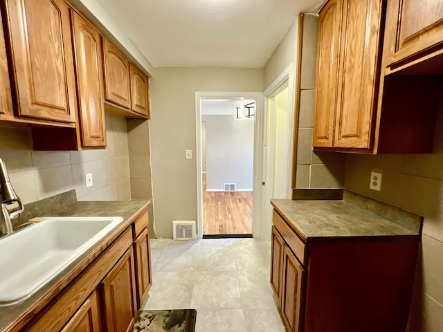 kitchen featuring sink and decorative backsplash