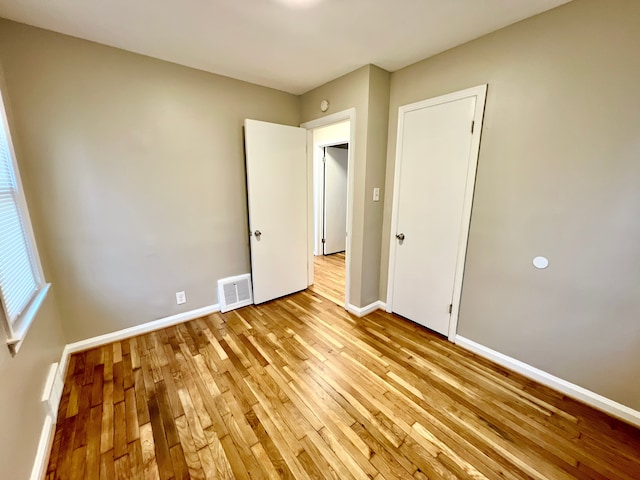 unfurnished bedroom with light hardwood / wood-style floors