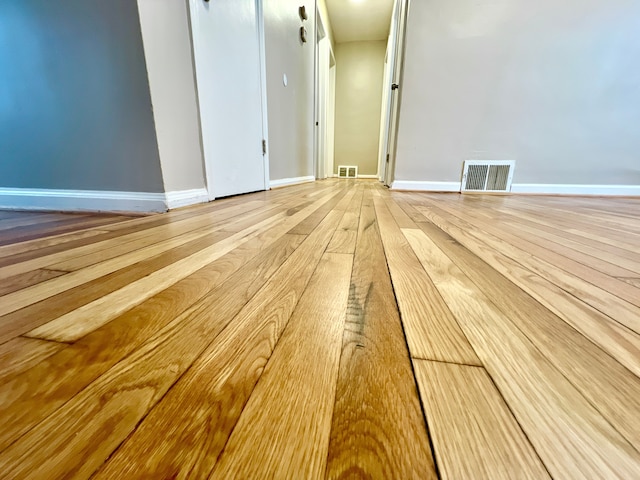 unfurnished room with light hardwood / wood-style floors