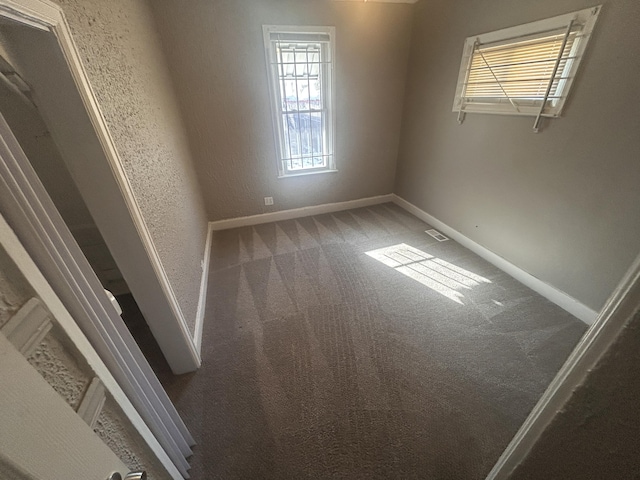 empty room with carpet flooring