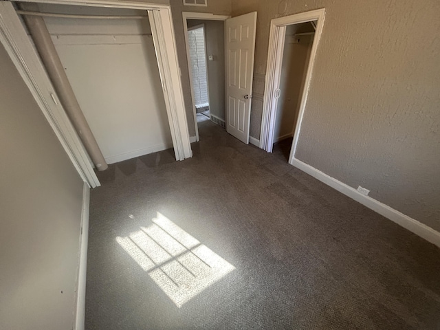 unfurnished bedroom featuring carpet