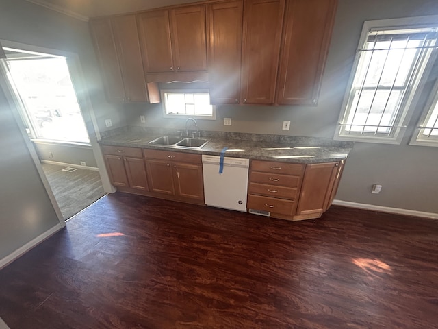 kitchen with sink, dark hardwood / wood-style floors, and dishwasher