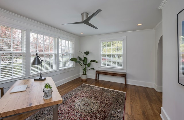 office with ornamental molding, dark wood-type flooring, and ceiling fan