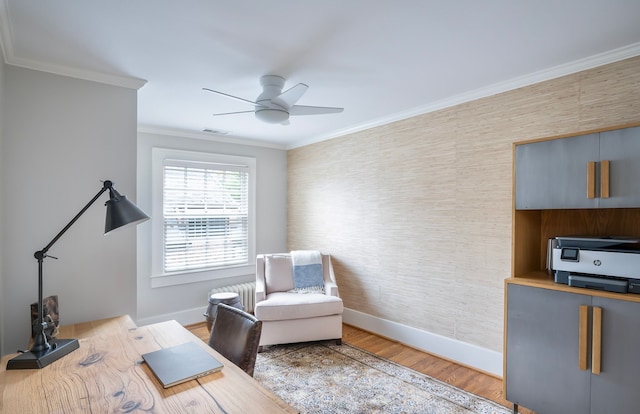 office featuring crown molding, ceiling fan, and hardwood / wood-style flooring