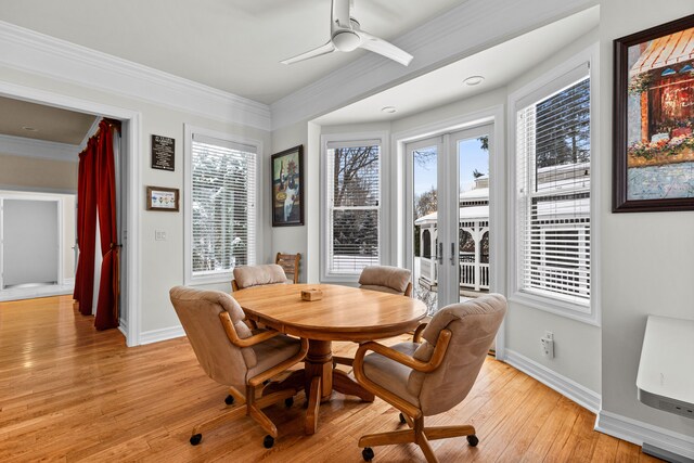 dining area featuring ornamental molding, ceiling fan, light hardwood / wood-style floors, and french doors