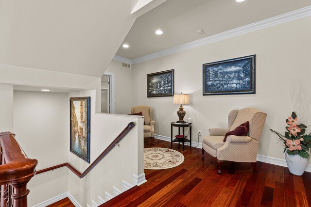 sitting room featuring hardwood / wood-style flooring and ornamental molding