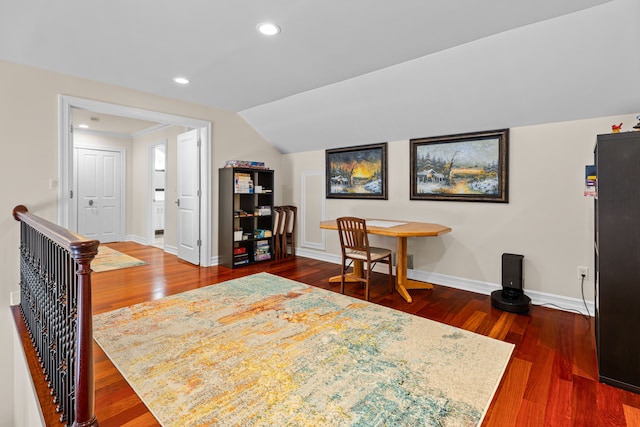 interior space with dark hardwood / wood-style flooring and vaulted ceiling