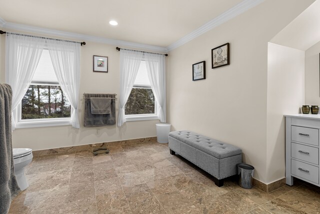 living area featuring crown molding