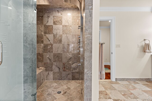 bathroom with crown molding and walk in shower