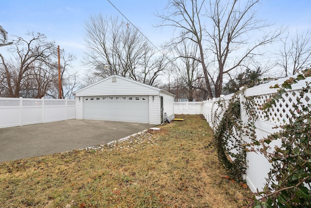 exterior space with an outbuilding, a yard, and a garage