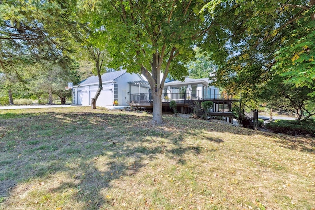 view of yard with a porch and a garage