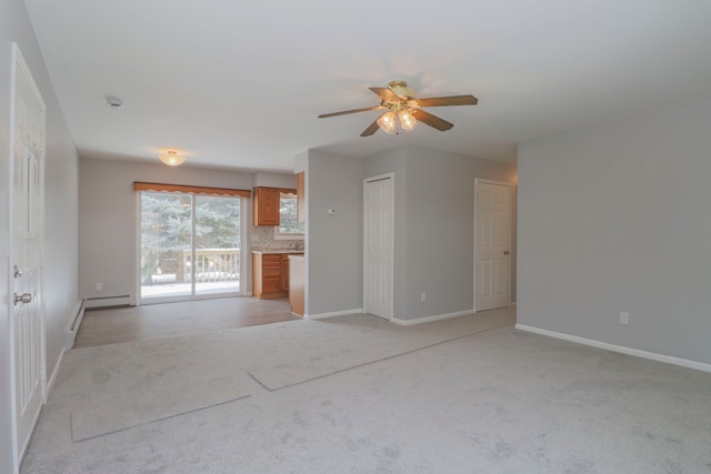 unfurnished living room with light carpet, a baseboard radiator, and ceiling fan