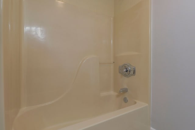 bathroom with washtub / shower combination