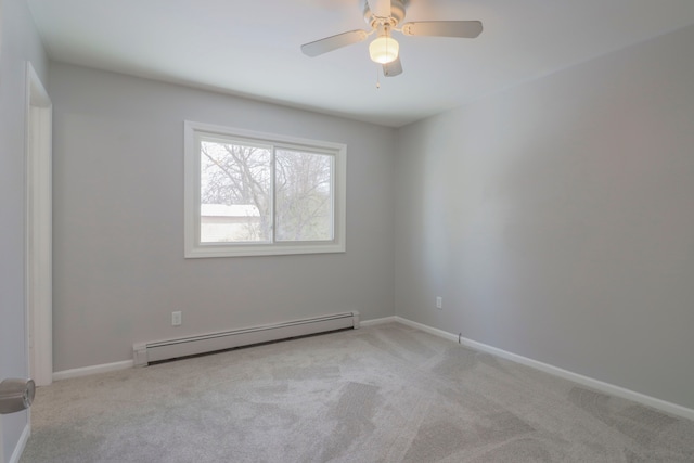 spare room with ceiling fan, a baseboard radiator, and light colored carpet