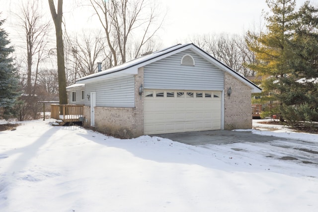 snow covered property featuring a deck